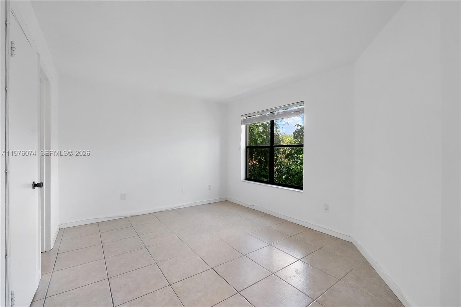 4221 West McNab Road, Unit 43 Pompano Beach, FL 33069 - Photo 4 of 17 an empty room with windows