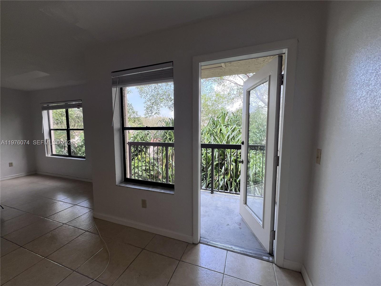 4221 West McNab Road, Unit 43 Pompano Beach, FL 33069 - Photo 5 of 23 a view of an empty room with a window