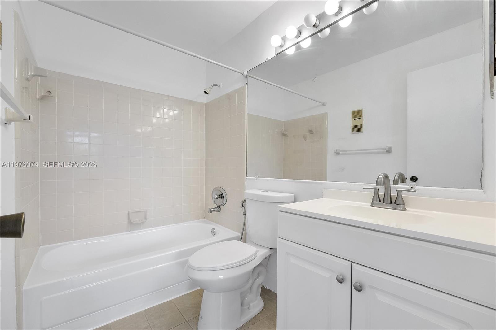4221 West McNab Road, Unit 43 Pompano Beach, FL 33069 - Photo 6 of 17 a bathroom with a sink a toilet and shower