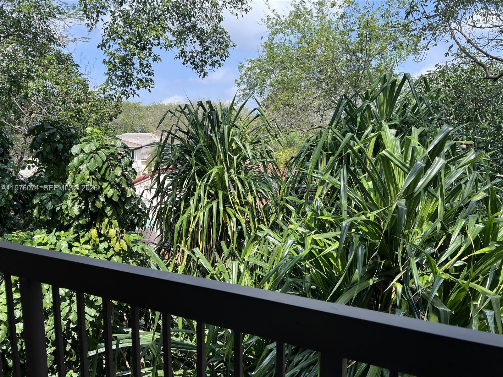 4221 West McNab Road, Unit 43 Pompano Beach, FL 33069 - Photo 9 of 17 a view of a garden from a balcony