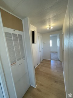 1265 North Corbonville Road, Unit 100 Price, UT 84501 - Photo 4 of 10 Corridor featuring a heating unit and light wood finished floors