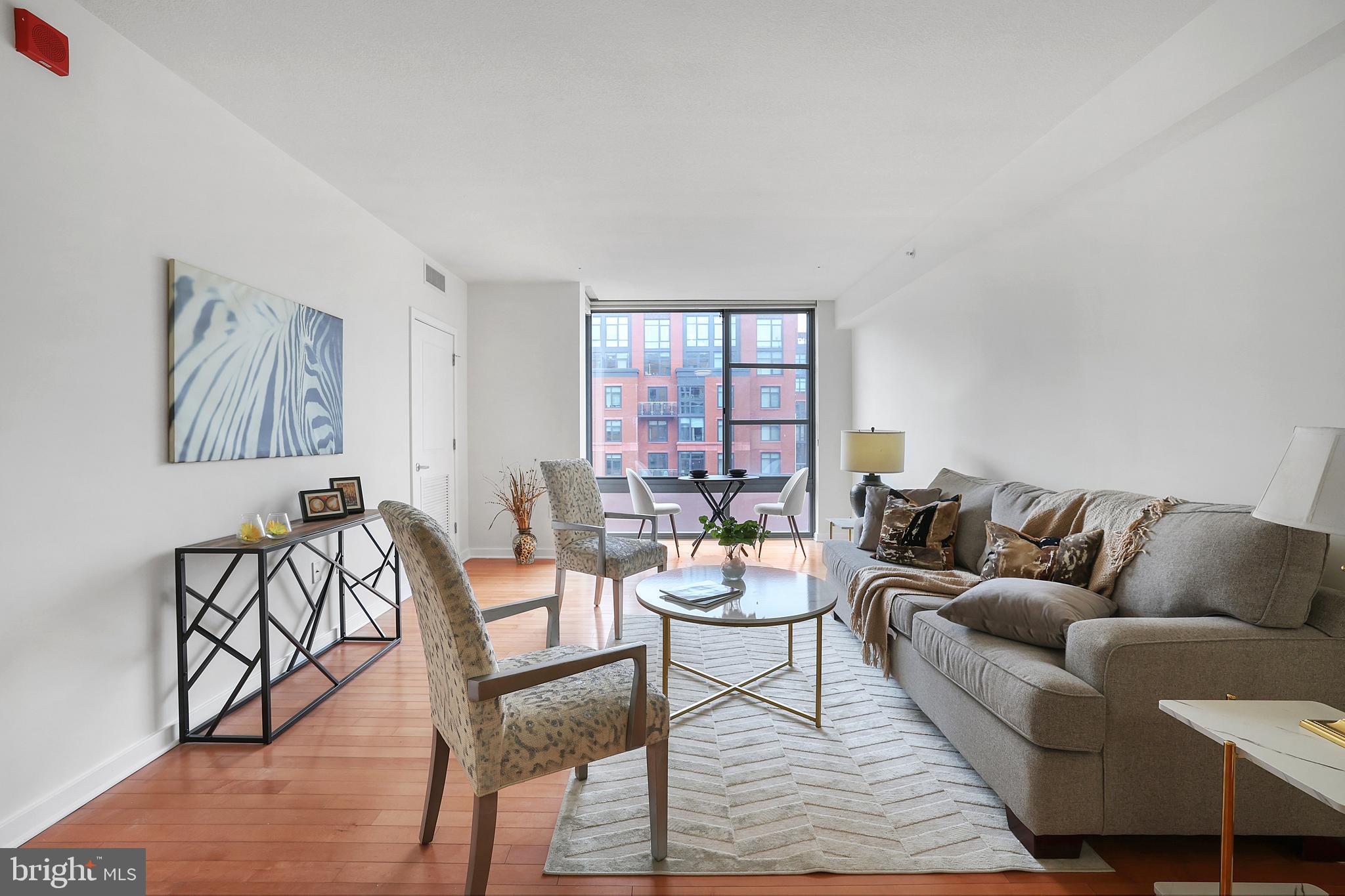 475 K Street Northwest, Unit 920 Washington, DC 20001 - Photo 1 of 25 a living room with furniture and a window