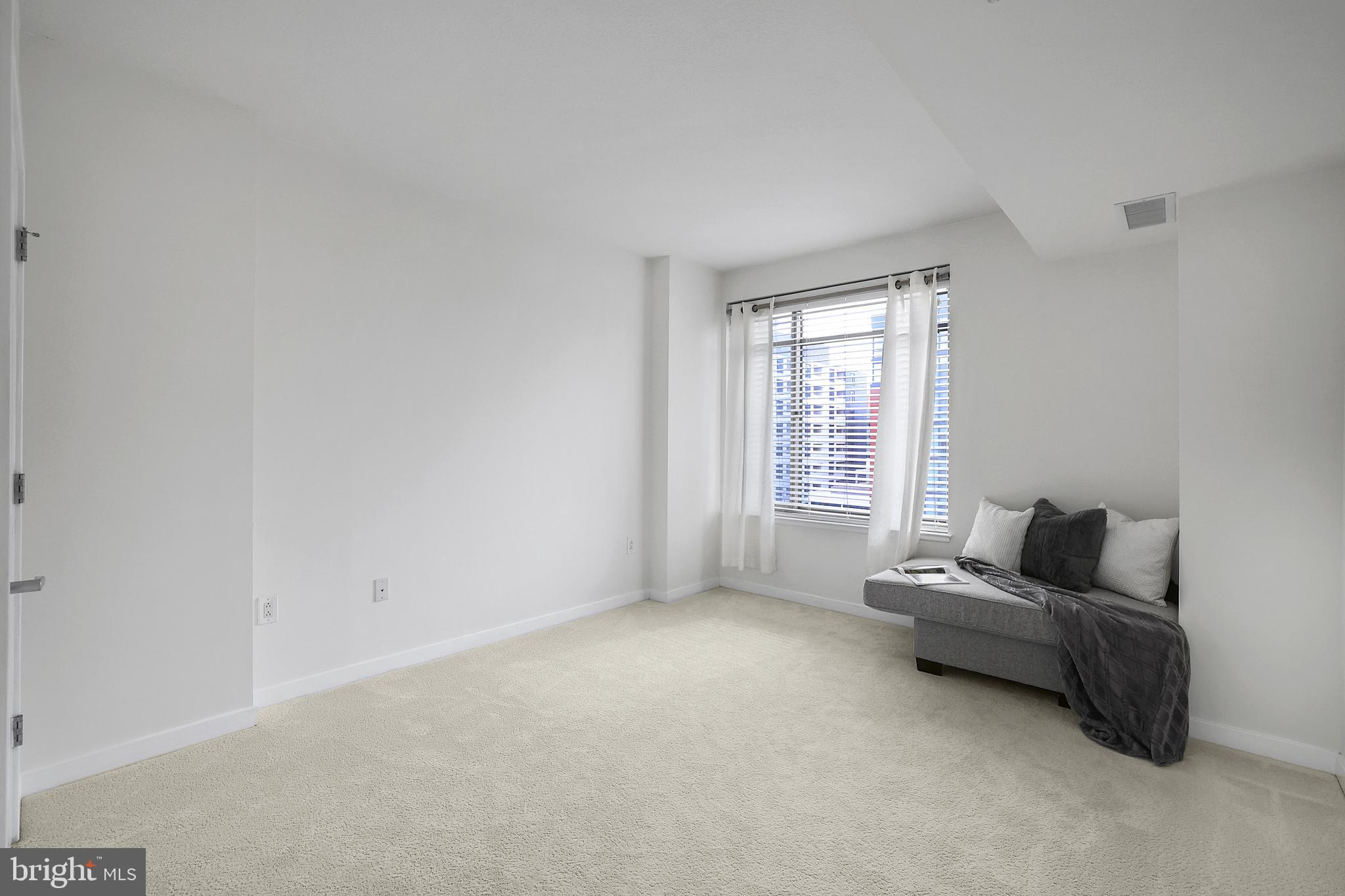 475 K Street Northwest, Unit 920 Washington, DC 20001 - Photo 11 of 25 a living room with furniture and a window