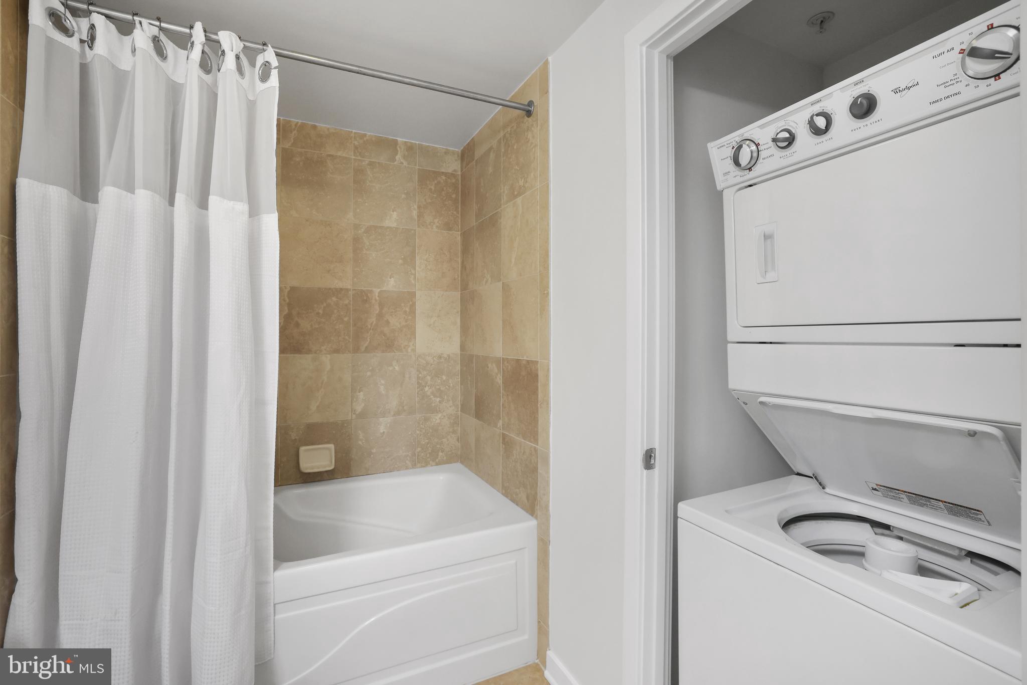 475 K Street Northwest, Unit 920 Washington, DC 20001 - Photo 16 of 25 a bathroom with a tub and a shower