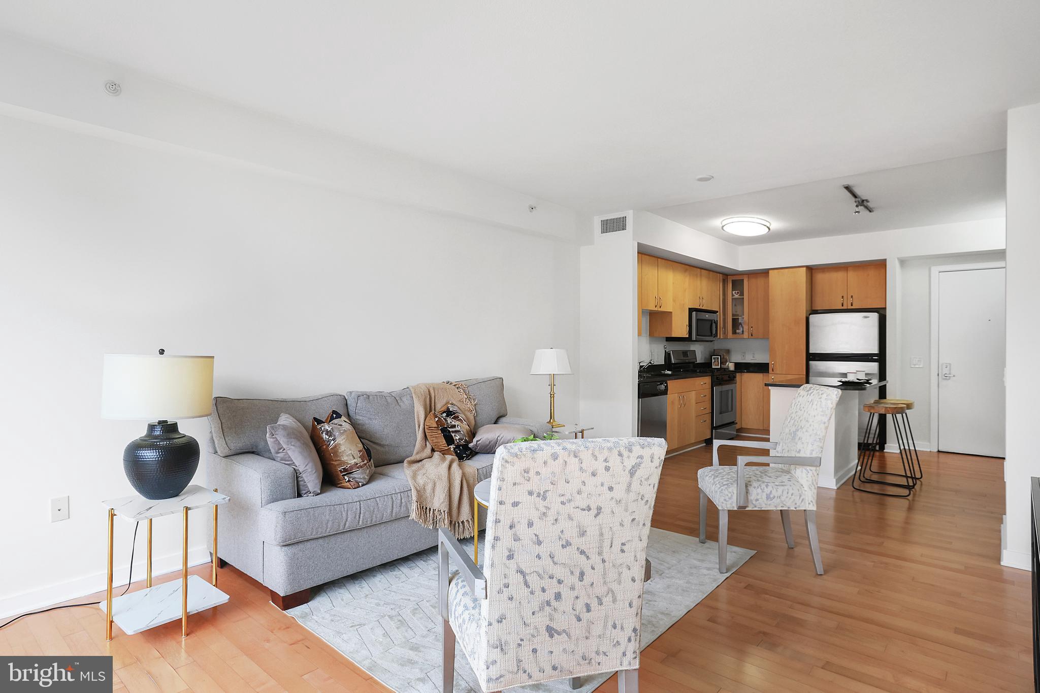 475 K Street Northwest, Unit 920 Washington, DC 20001 - Photo 7 of 25 a living room with furniture and view of kitchen