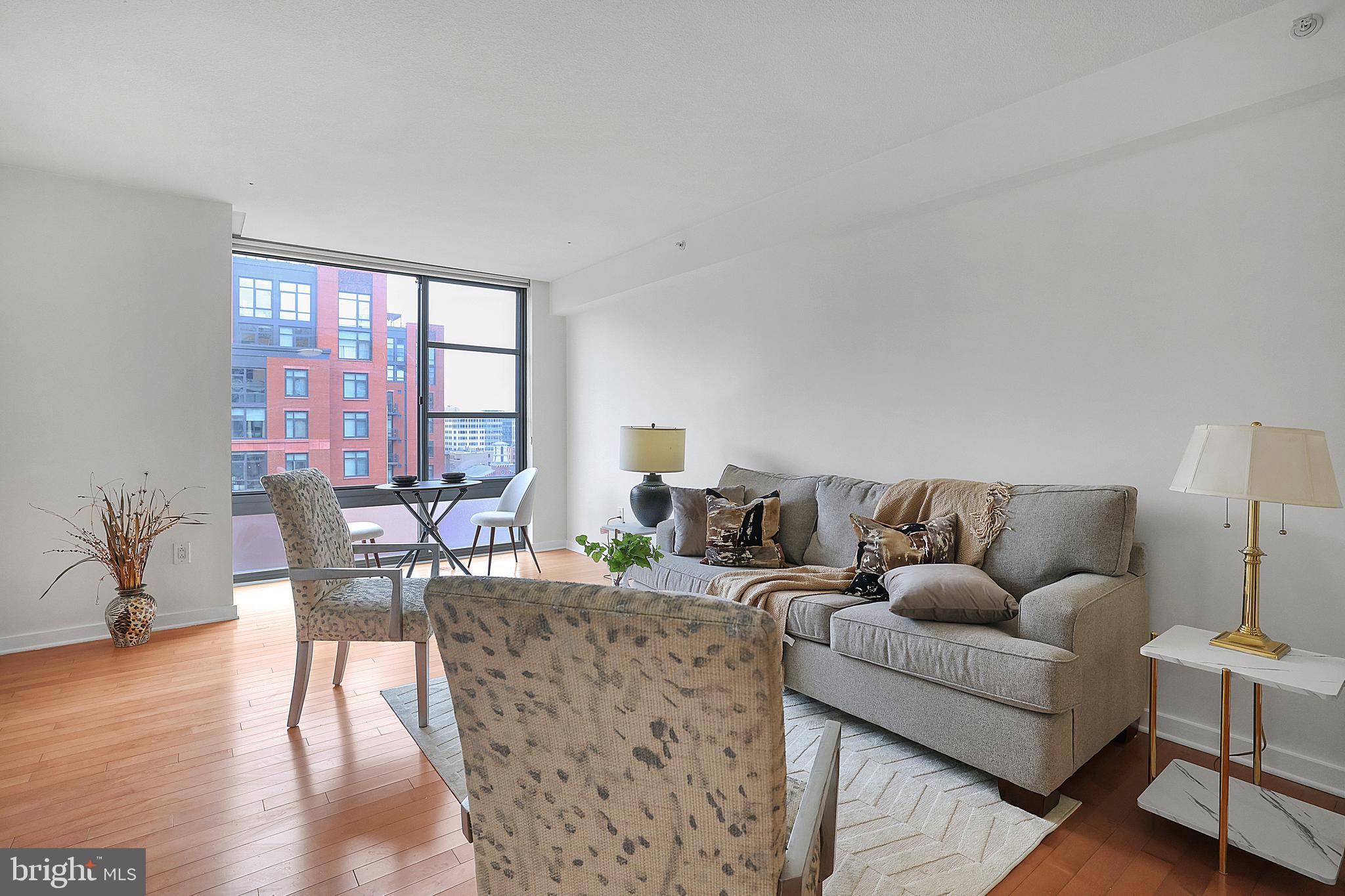 475 K Street Northwest, Unit 920 Washington, DC 20001 - Photo 8 of 25 a living room with furniture and a large window