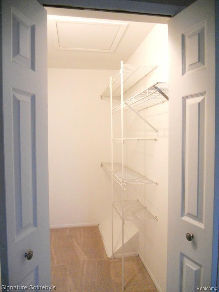 22262 Pondview, Unit 19 Novi, MI 48375 - Photo 16 of 29 Walk in Master Bedroom closet