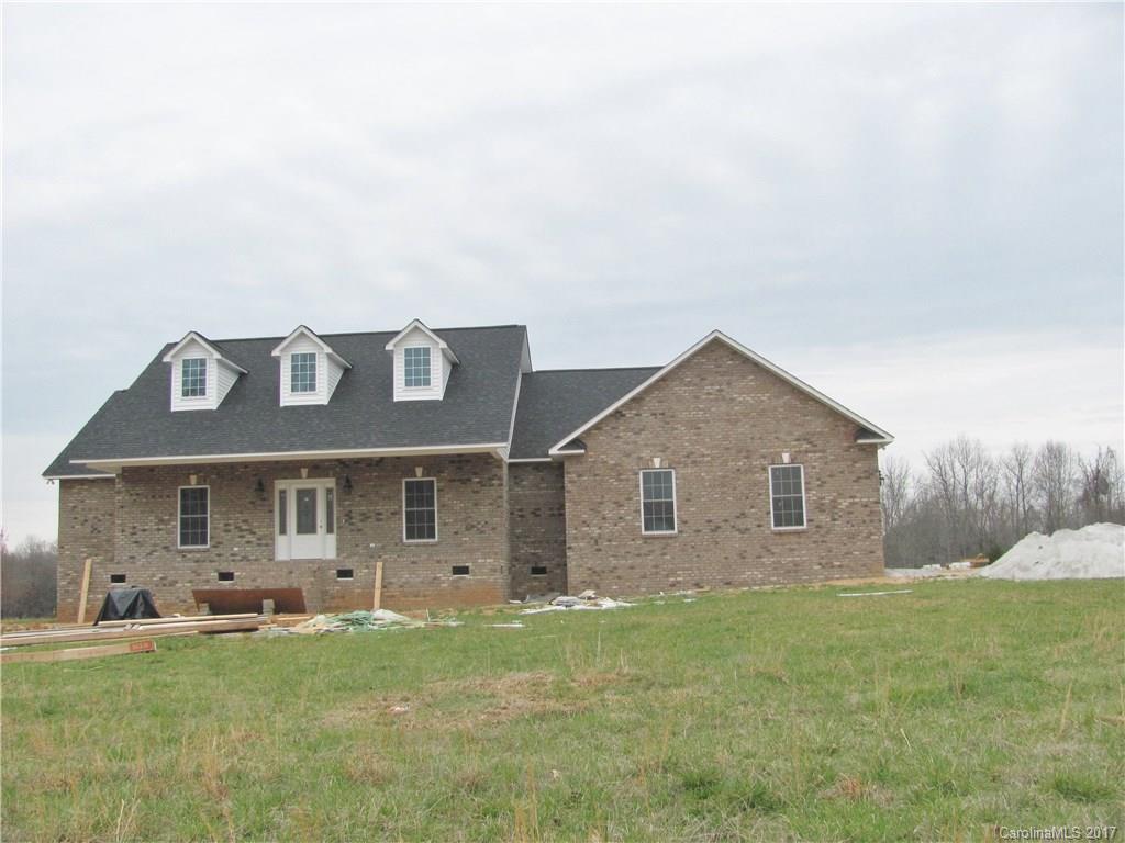 485 Mason Dickson Road, Unit 4 York, SC 29745 - Photo 1 of 12 a front view of a house with a garden and yard