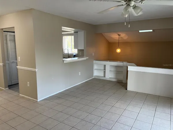 a view of a kitchen with a sink and cabinets