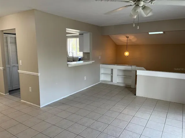 a view of a kitchen with a sink and cabinets