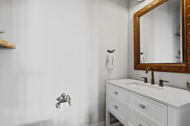 a view of a balcony with couches and wooden floor