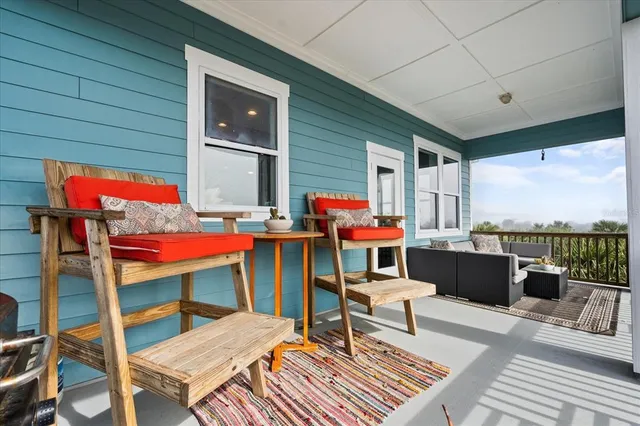 a front view of house with yard and trees around