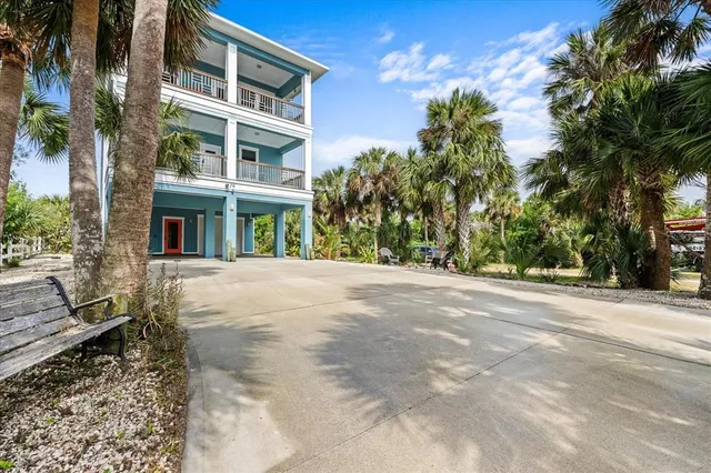 an aerial view of a houses with a lake view