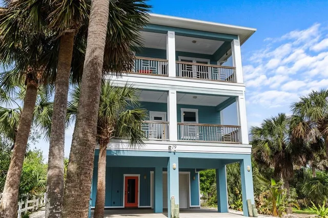 a picture of a bench in front of a wall