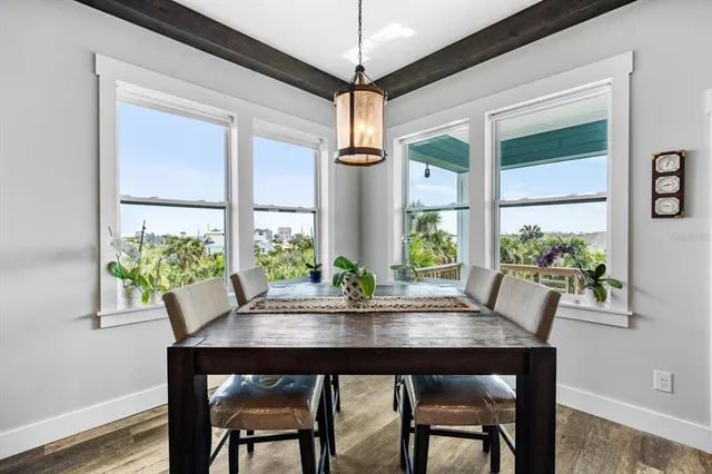 a view of balcony with wooden floor and outdoor seating