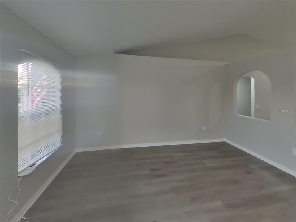 Undisclosed Address Spring Hill, FL 34609 - Photo 16 of 17 a view of an empty room and window