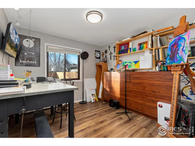 a view of a dining room with furniture and a kitchen