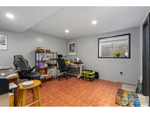 a workspace with furniture and a window