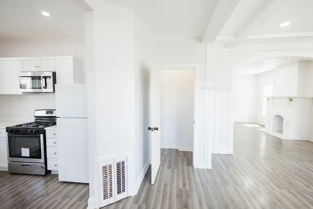 a view of a kitchen from the hallway