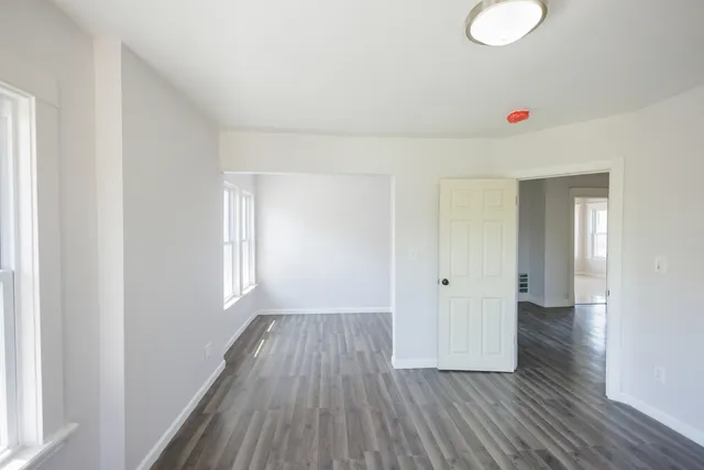a view of a livingroom with wooden floor