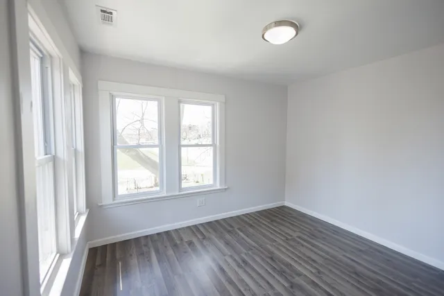 a very nice looking room with wooden floor