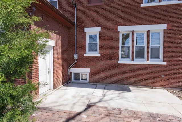 a brick house with a large windows