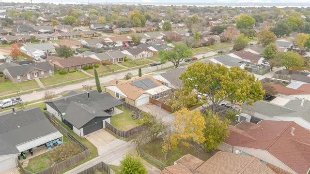 an aerial view of residential houses with outdoor space