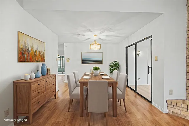 a dining room with furniture and window