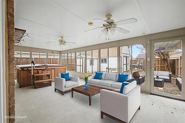 a living room with furniture and flat screen tv
