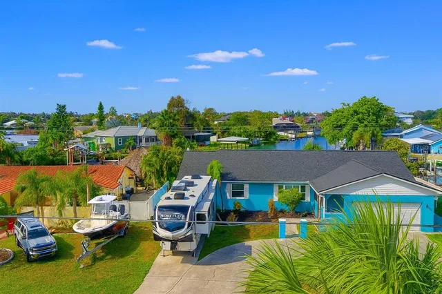 a view of a patio with table and chairs and potted plants