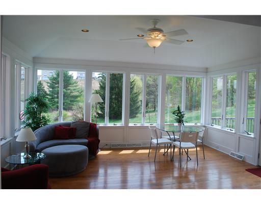 Kitchen. Sunroom is directly off of kitchen and leads to deck.