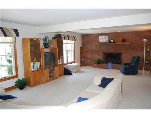 Den/Family/Great Room. Oversized family room is located off of the kitchen and has a gas fireplace which encompasses the entire back wall.