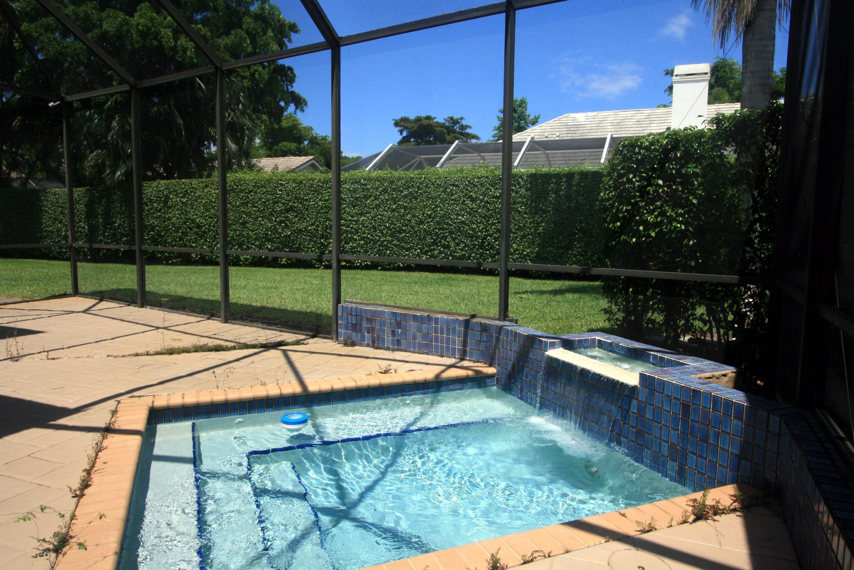 4468 Northwest 29th Way Boca Raton, FL 33434 - Photo 18 of 36 Pool with Waterfall feature