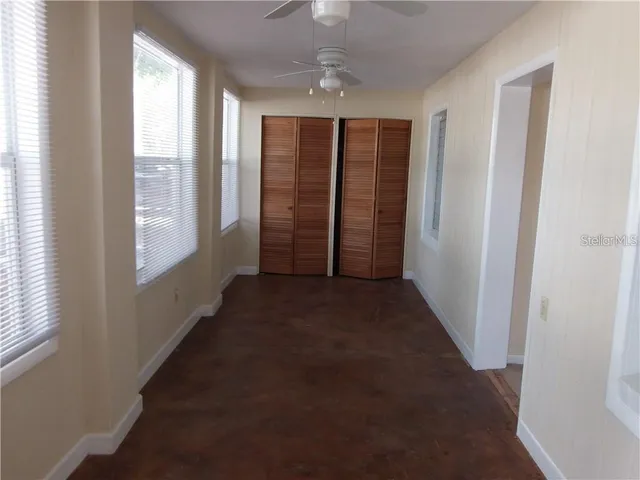 a view of a hallway with windows