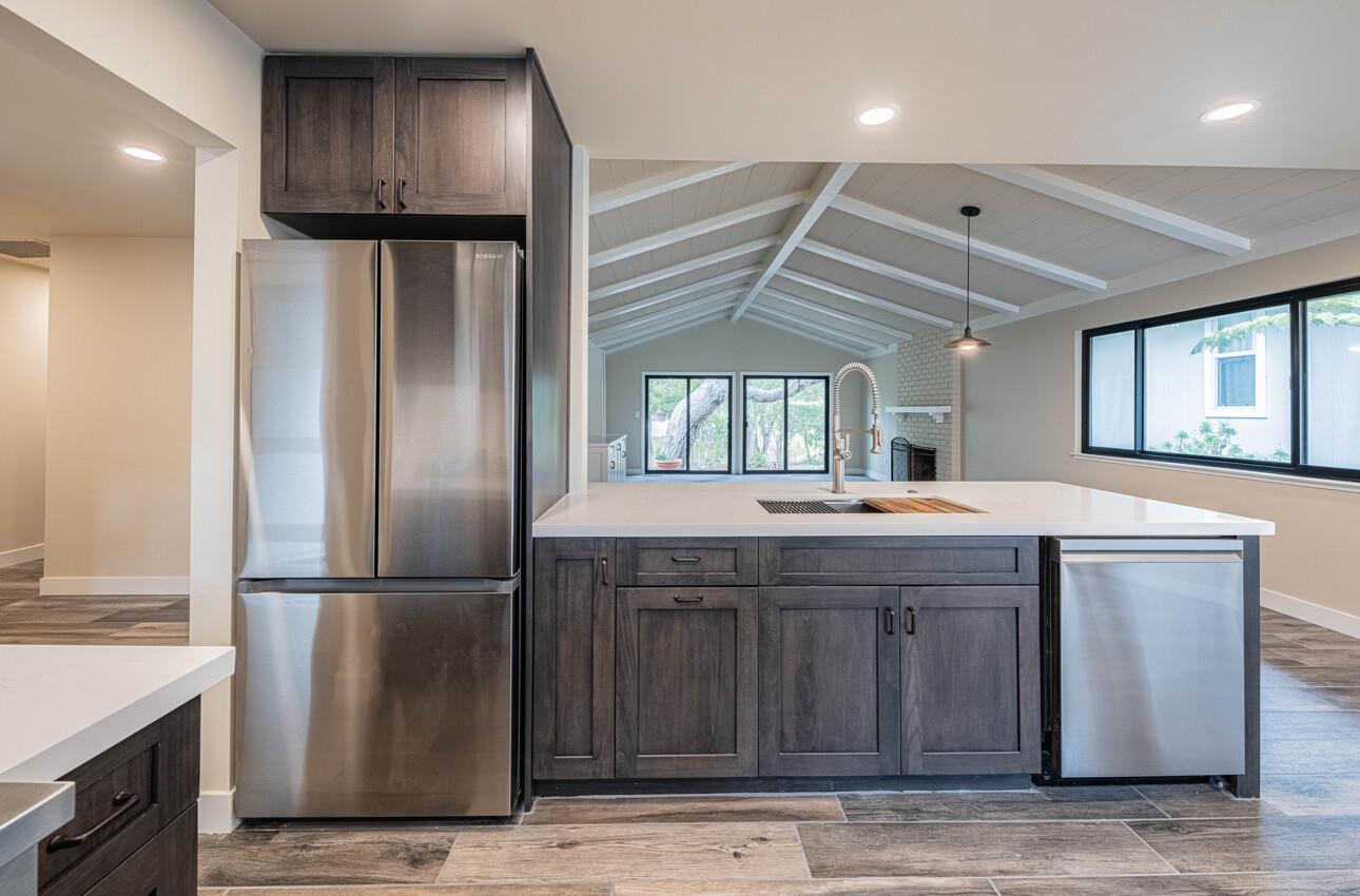 52 Country Club Gate Pacific Grove, CA 93950 - Photo 14 of 37 a kitchen with kitchen island a sink stainless steel appliances and cabinets