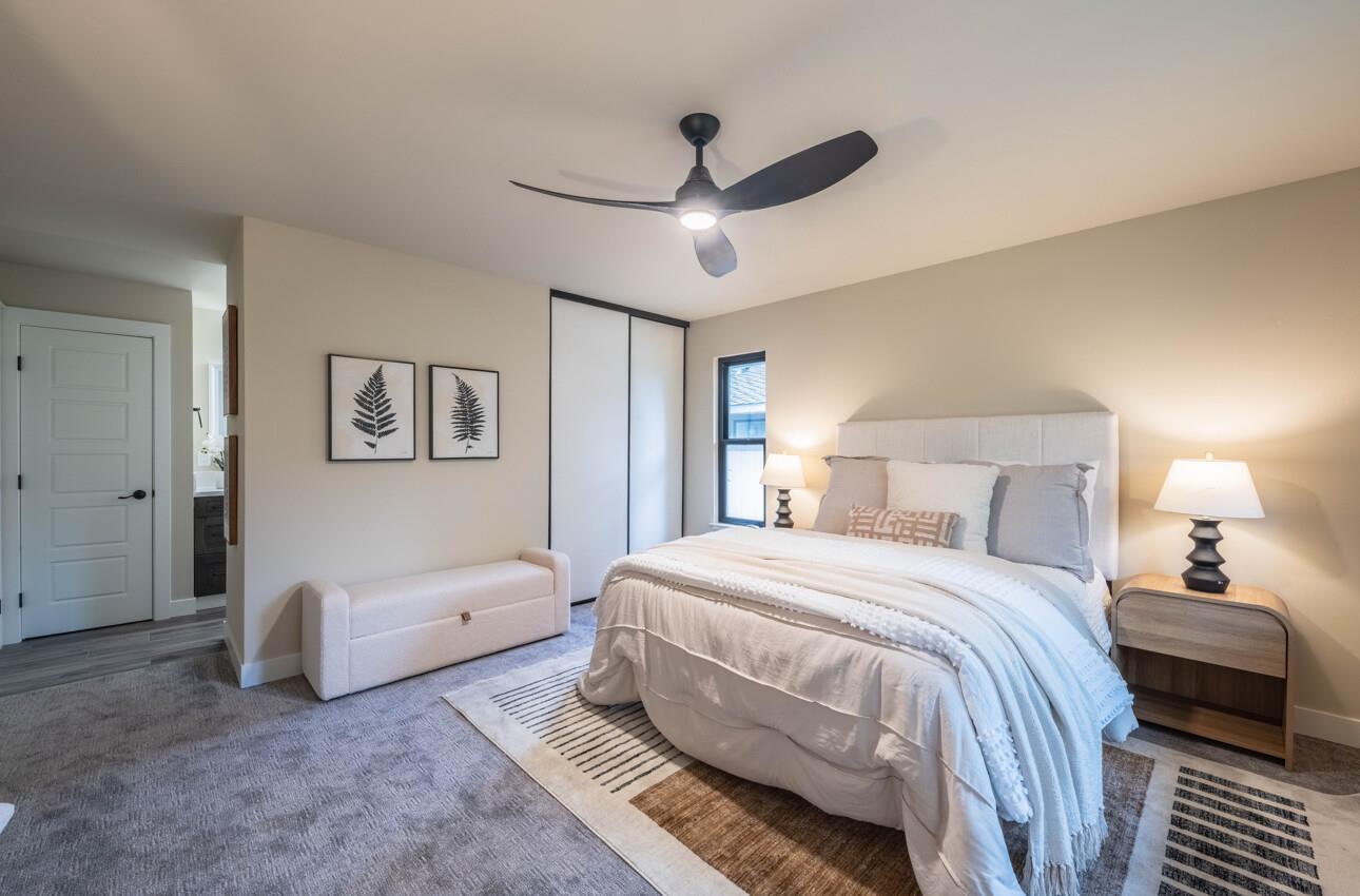 52 Country Club Gate Pacific Grove, CA 93950 - Photo 19 of 37 a bedroom with a bed and a chandelier