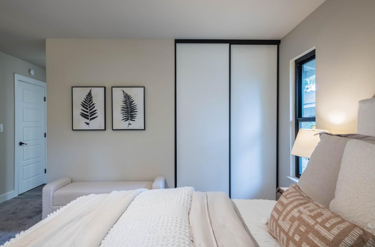 52 Country Club Gate Pacific Grove, CA 93950 - Photo 20 of 37 a bedroom with a bed and a painting on the wall