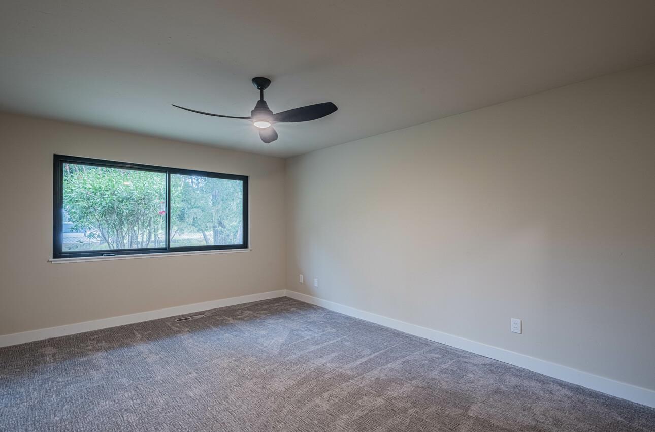 52 Country Club Gate Pacific Grove, CA 93950 - Photo 24 of 37 an empty room with a window and a fan