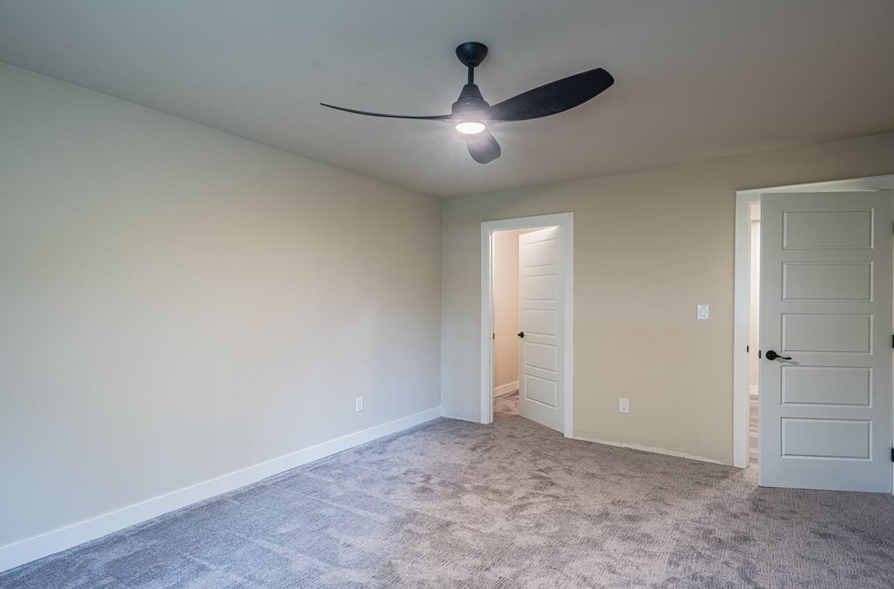 52 Country Club Gate Pacific Grove, CA 93950 - Photo 26 of 37 an empty room with chandelier fan