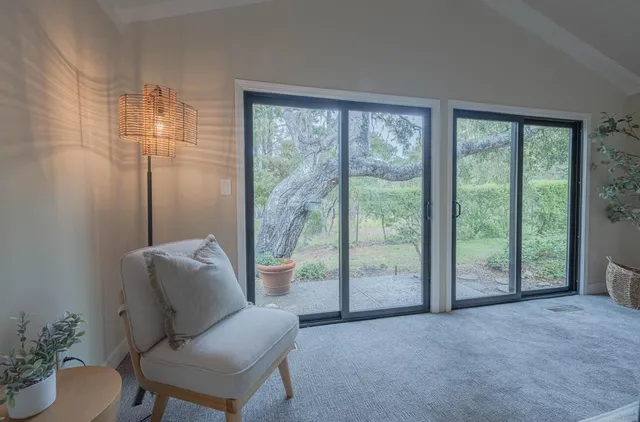 a dining room with a table and chairs