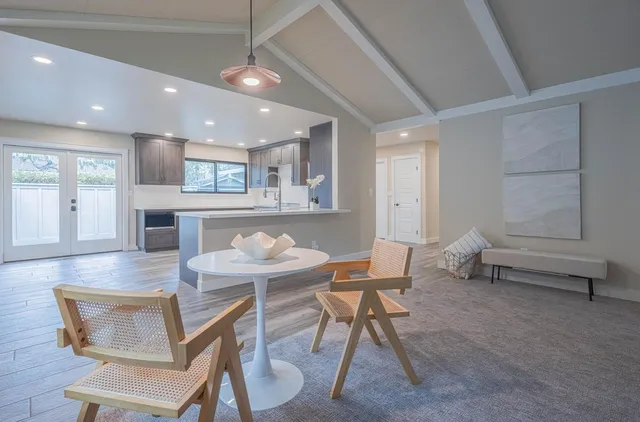 a view of kitchen with cabinets and wooden floor