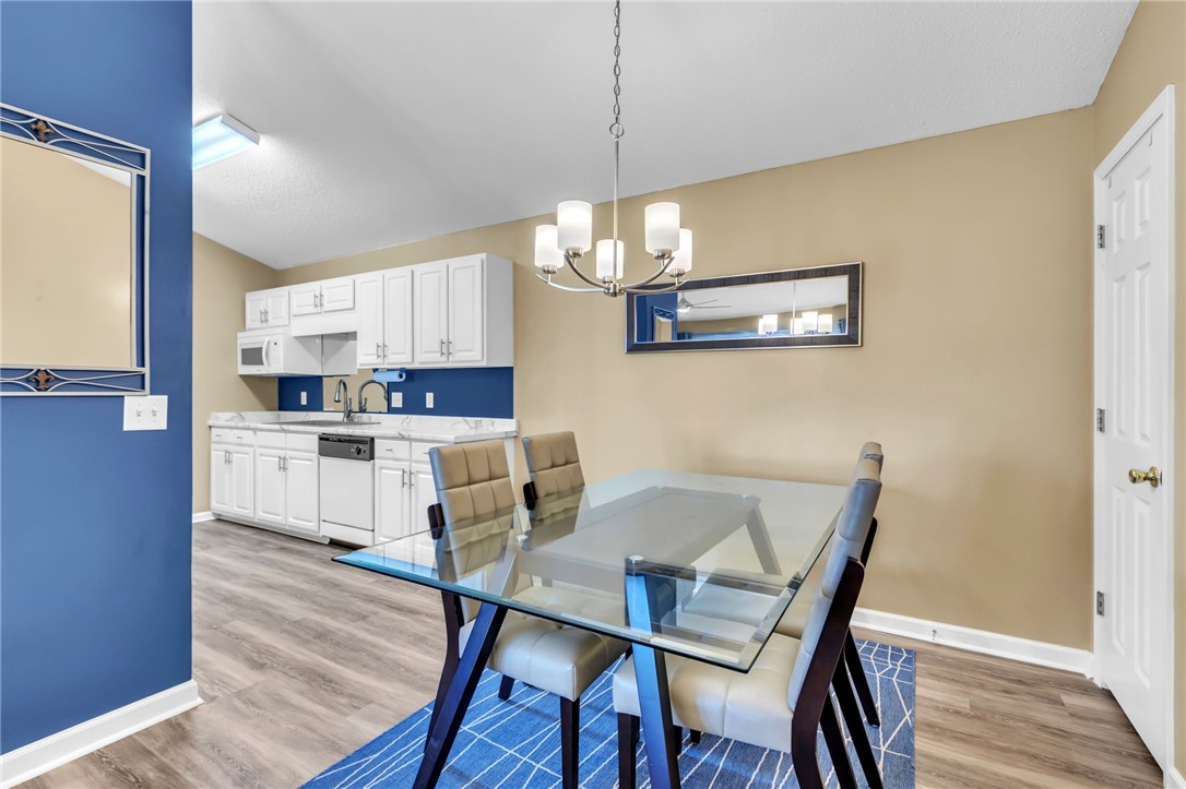706 Pelham Square Way Greer, SC 29650 - Photo 7 of 20 This bright dining area features an open concept layout, perfect for casual meals and entertaining.
