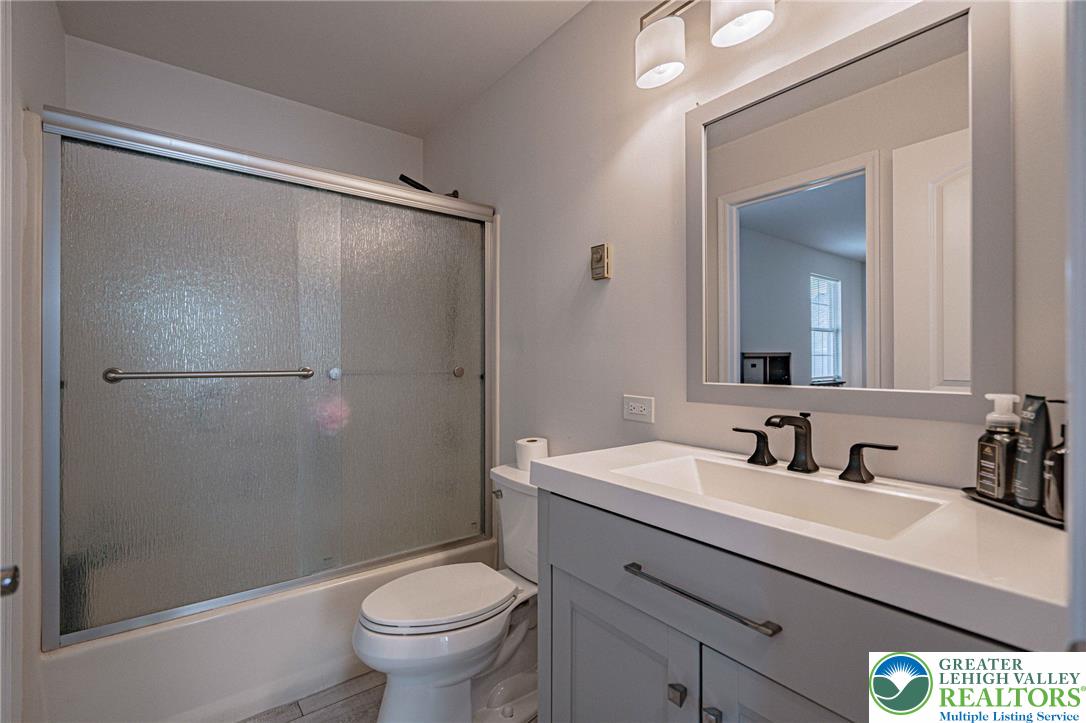 25 North 8th Street Emmaus, PA 18049 - Photo 19 of 51 A well-appointed bathroom with a sleek vanity and a practical tub-shower combination.