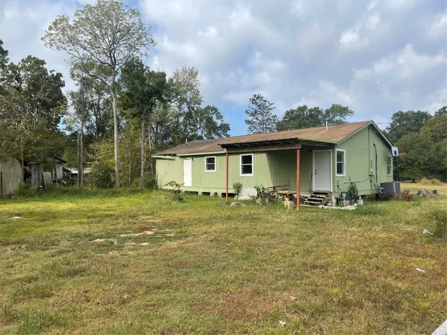 a front view of house with yard and seating area