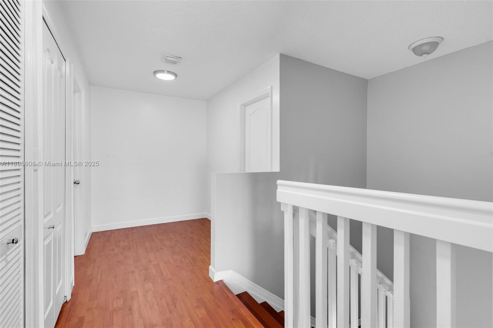 2883 Southwest 129th Terrace, Unit 2883 Miramar, FL 33027 - Photo 8 of 18 a view of a room with wooden floor