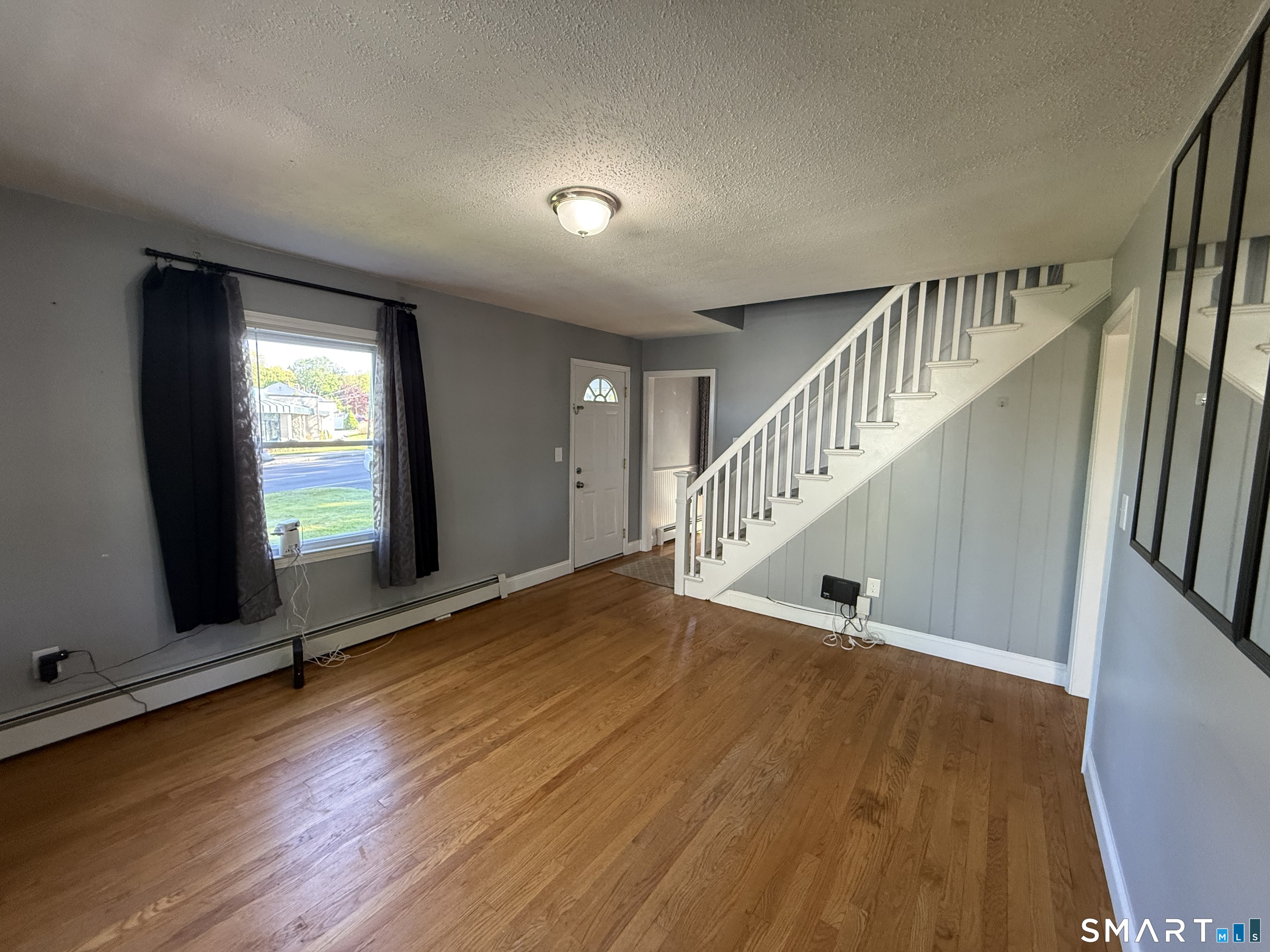 808 East Main Street Torrington, CT 06790 - Photo 25 of 40 a view of entryway and hall with wooden floor