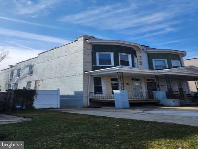 609 East 41st Street Baltimore, MD 21218 - Photo 1 of 9 a view of a house with a yard