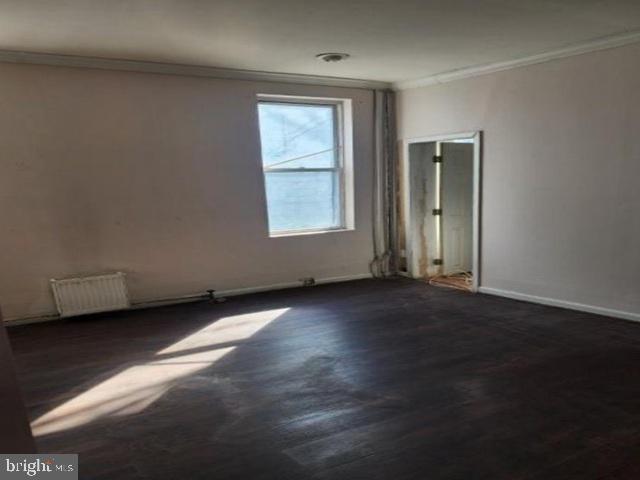 609 East 41st Street Baltimore, MD 21218 - Photo 8 of 9 an empty room with a window