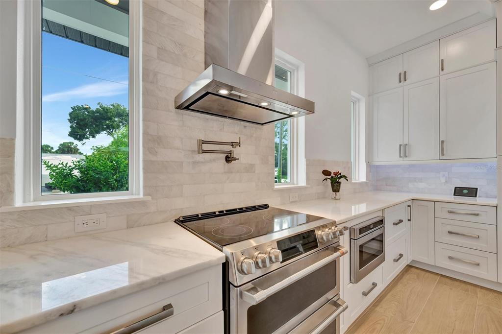 916 Highland Street Sarasota, FL 34234 - Photo 15 of 48 a kitchen with a stove and a sink