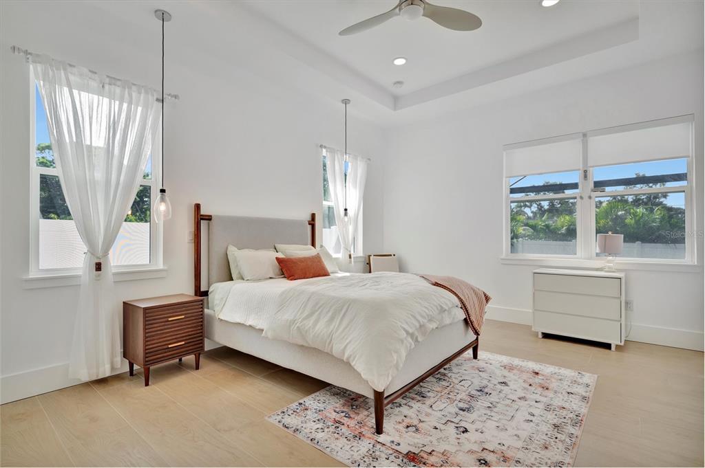 916 Highland Street Sarasota, FL 34234 - Photo 17 of 48 a bedroom with a bed and a window